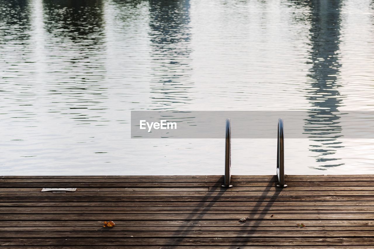 High angle view of wooden plank by lake