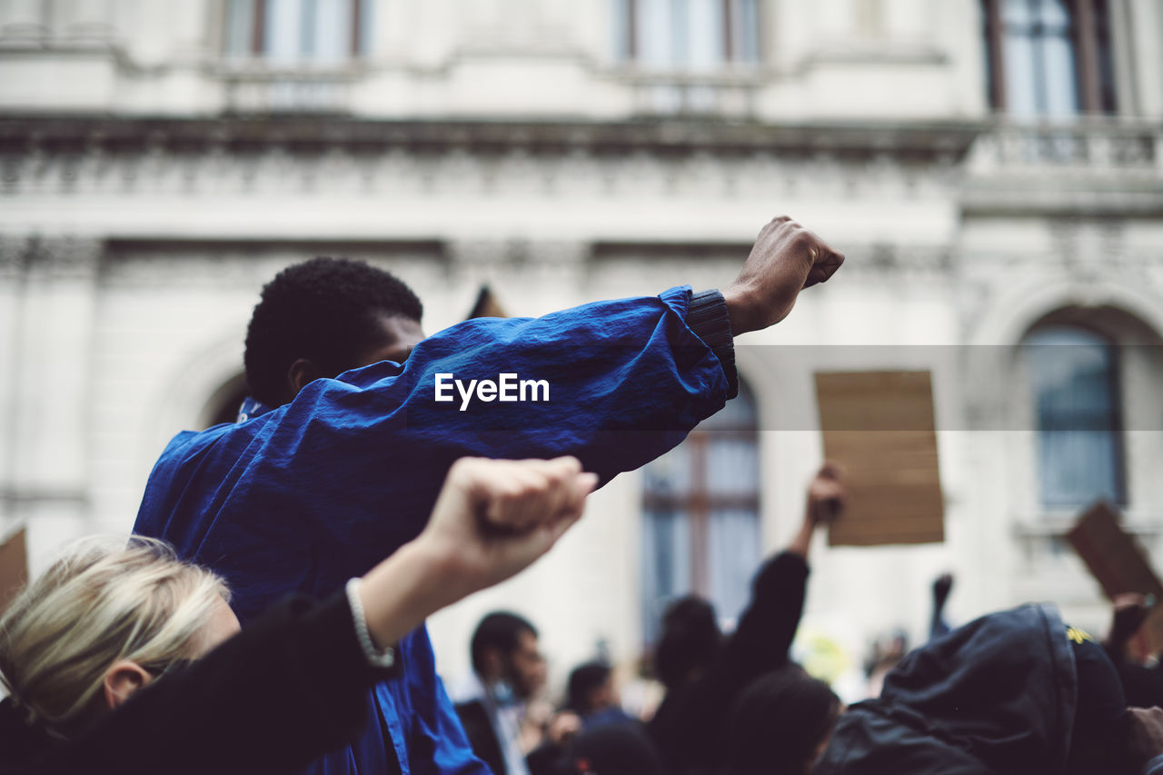 Black lives matter protester raised fist blm