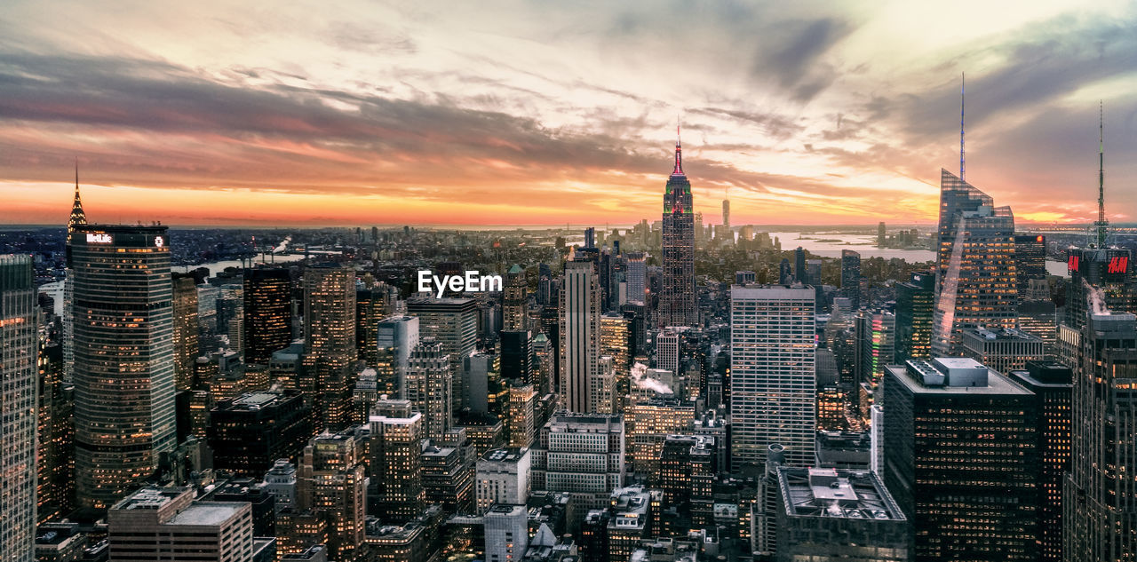 Aerial view of city at sunset