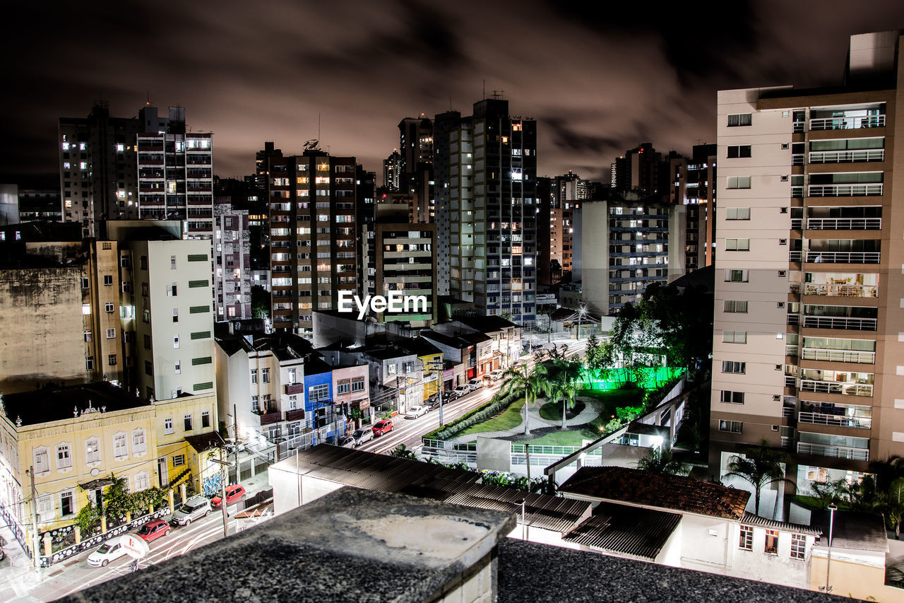 Illuminated buildings in city at night