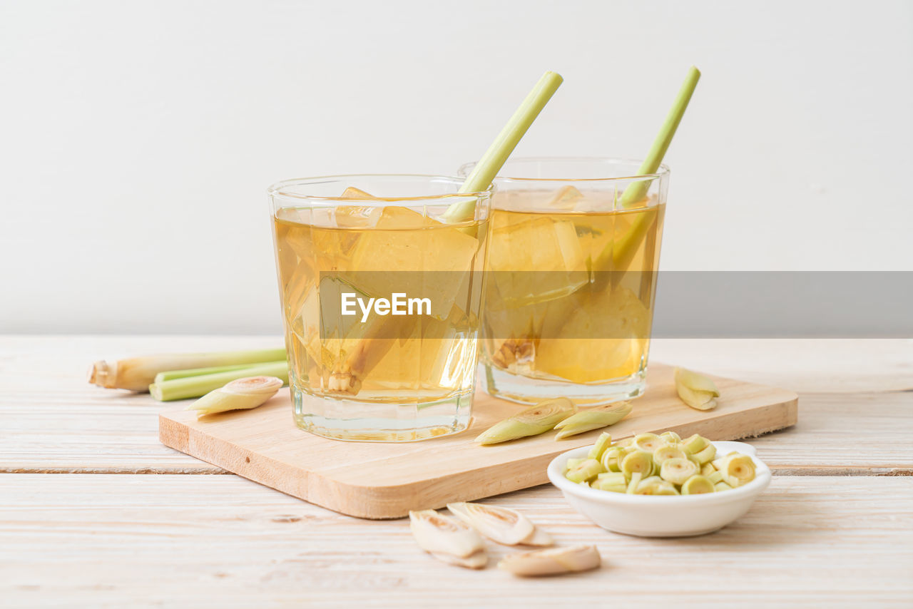 close-up of drink in glass on table against white background