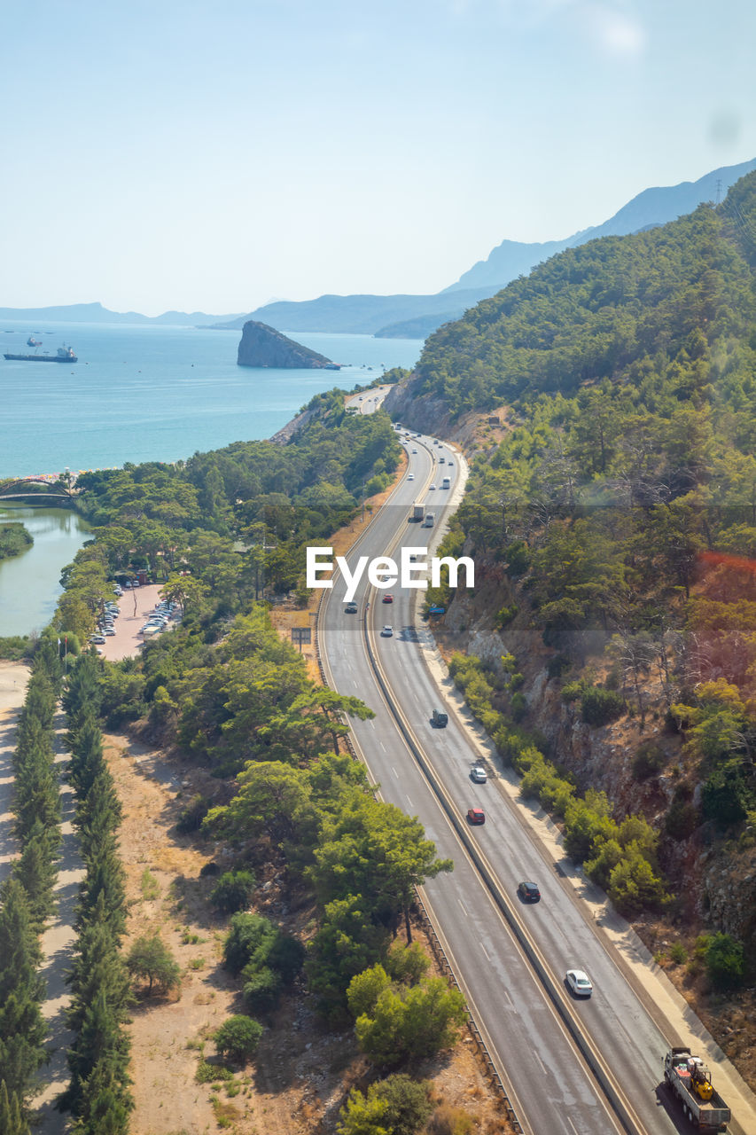 High angle view of road by sea against sky