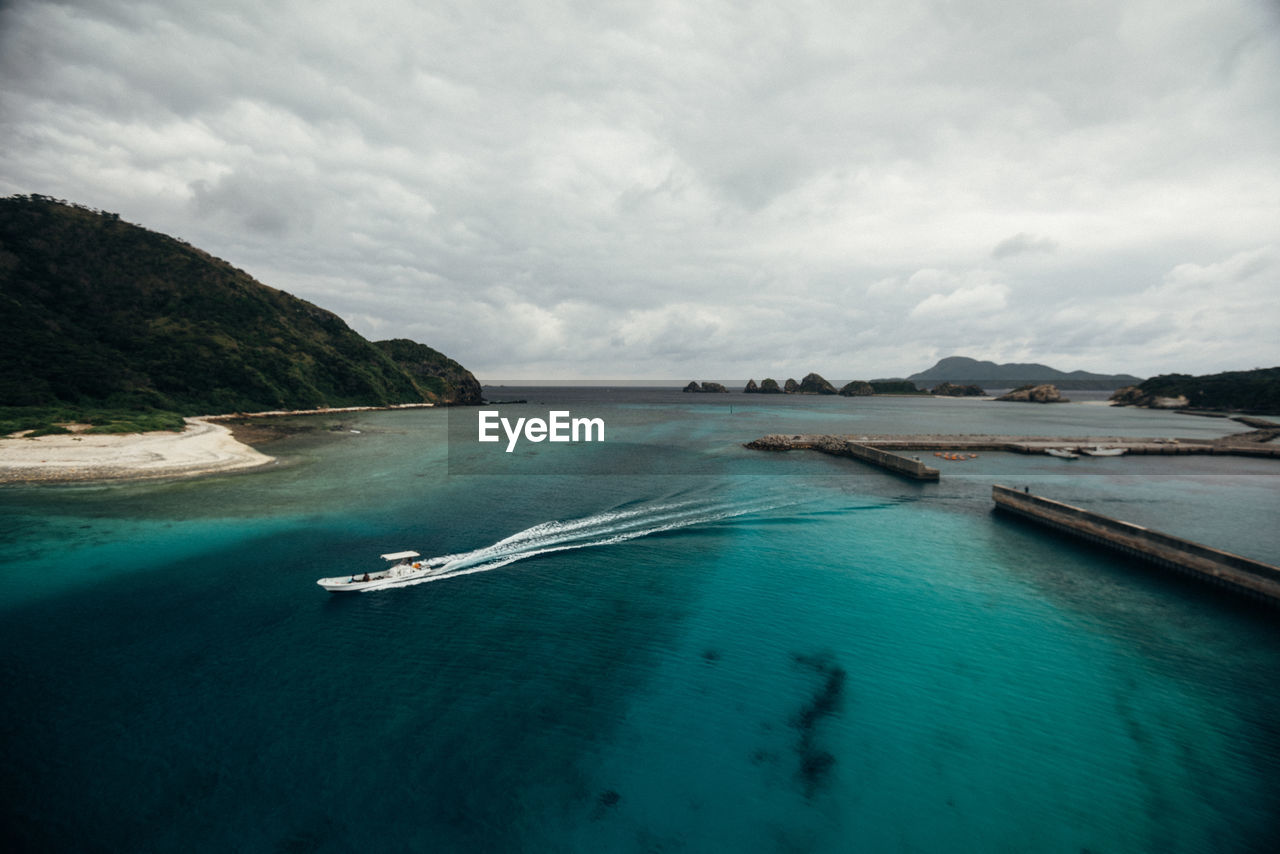 Scenic view of sea against cloudy sky