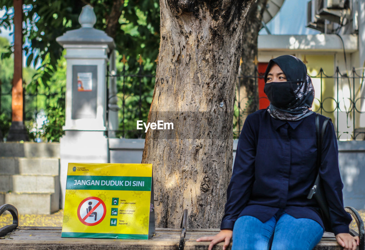 Woman sitting for physical distancing