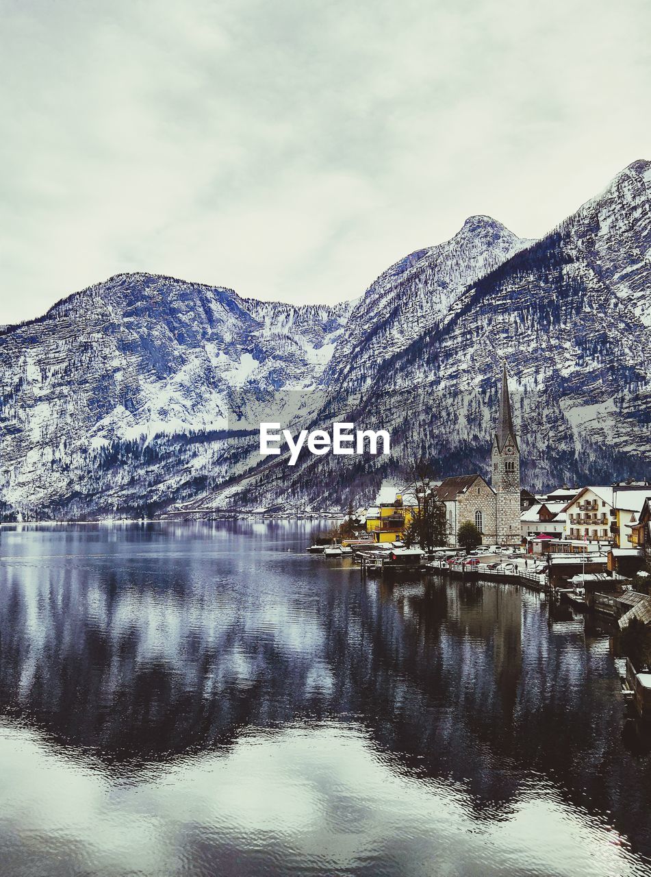 Scenic view of snowcapped mountains and lake against sky