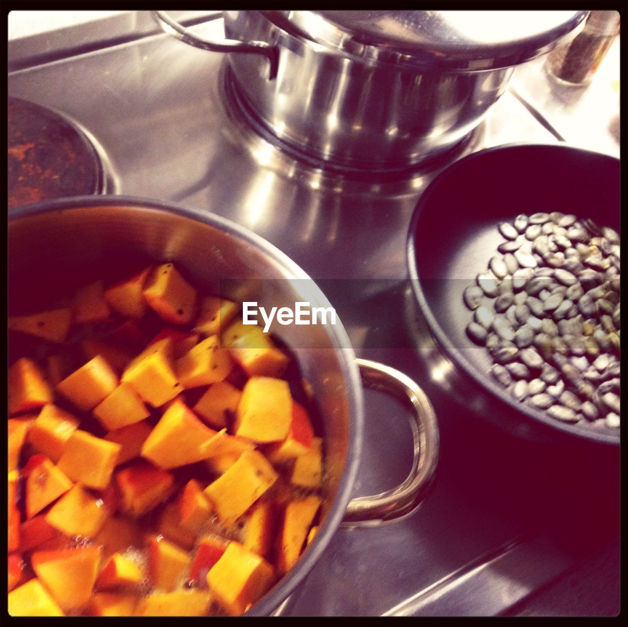 High angle view of pumpkin with seed on stove