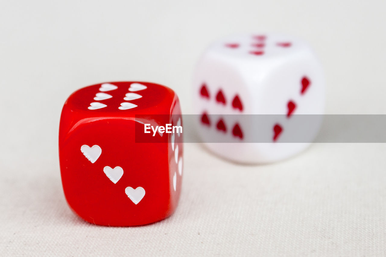 Red and white dices with hearts