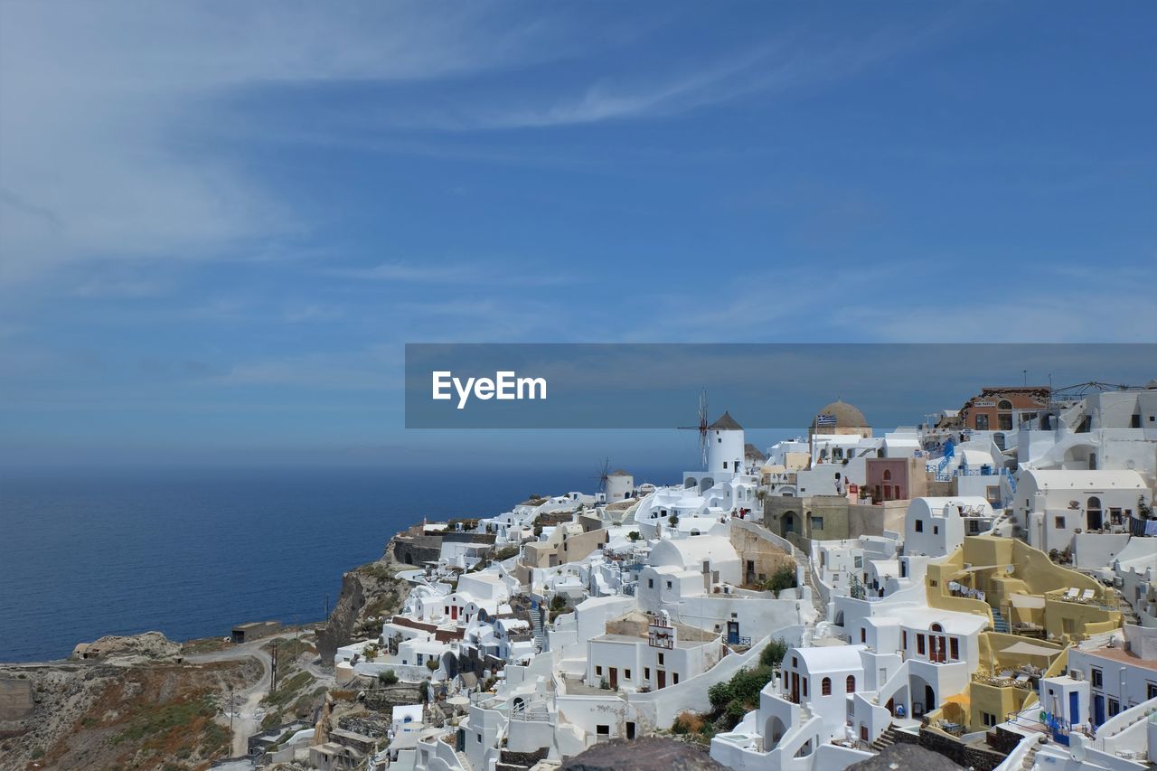 BUILDINGS BY SEA AGAINST SKY