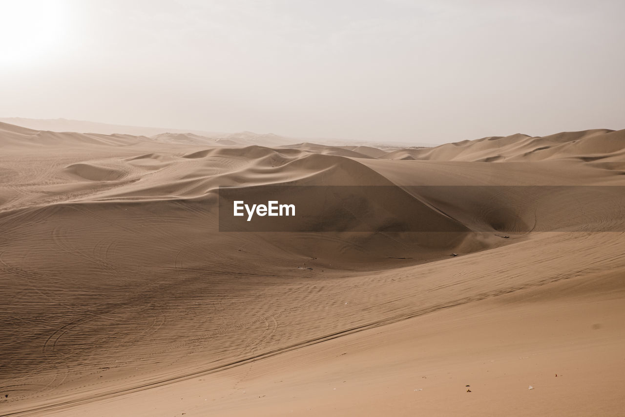 Scenic view of desert against sky in peru