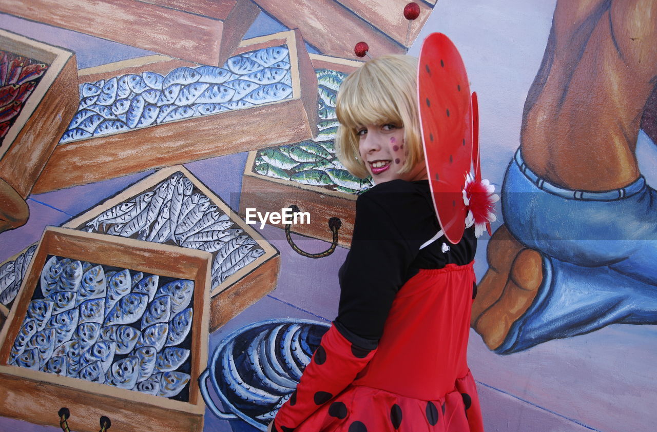 CLOSE-UP OF WOMAN STANDING ON GROUND