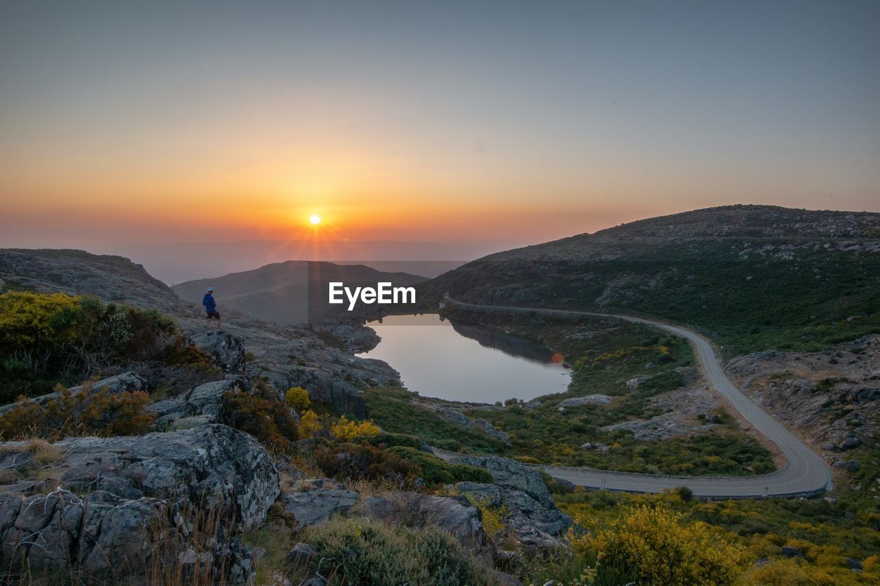 Scenic view of mountain against sky during sunset