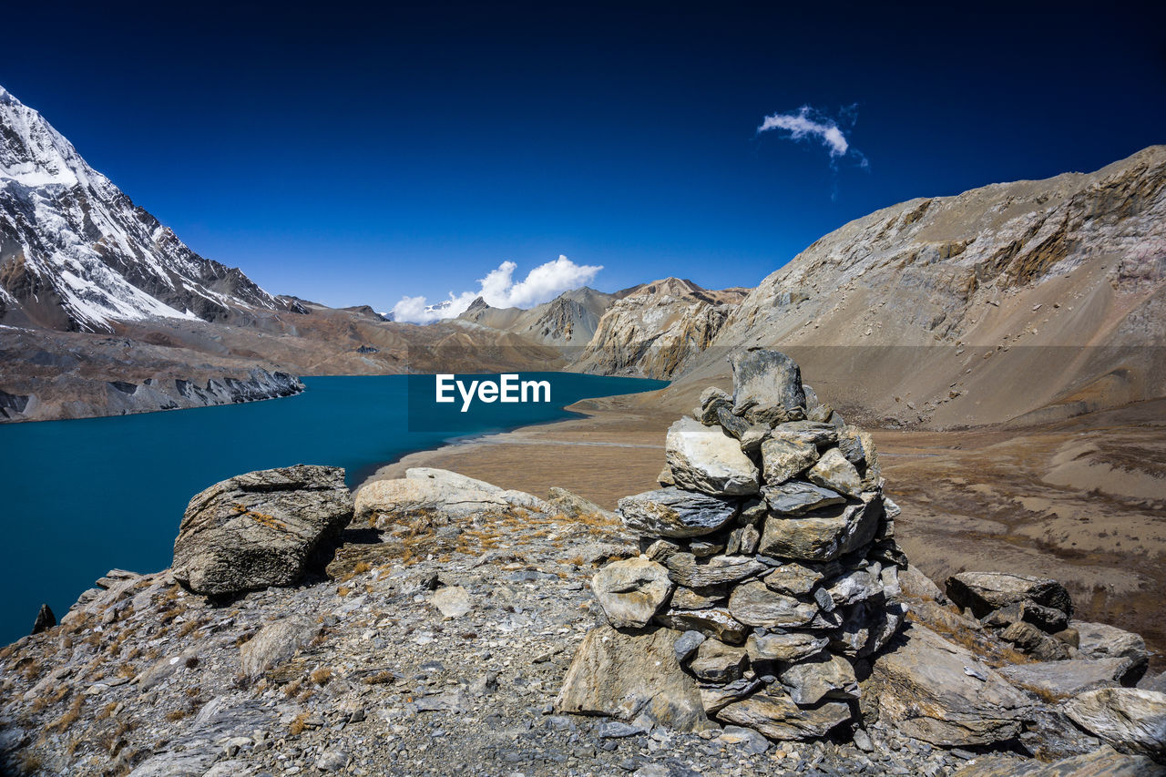 Scenic view of rocky mountains against blue sky