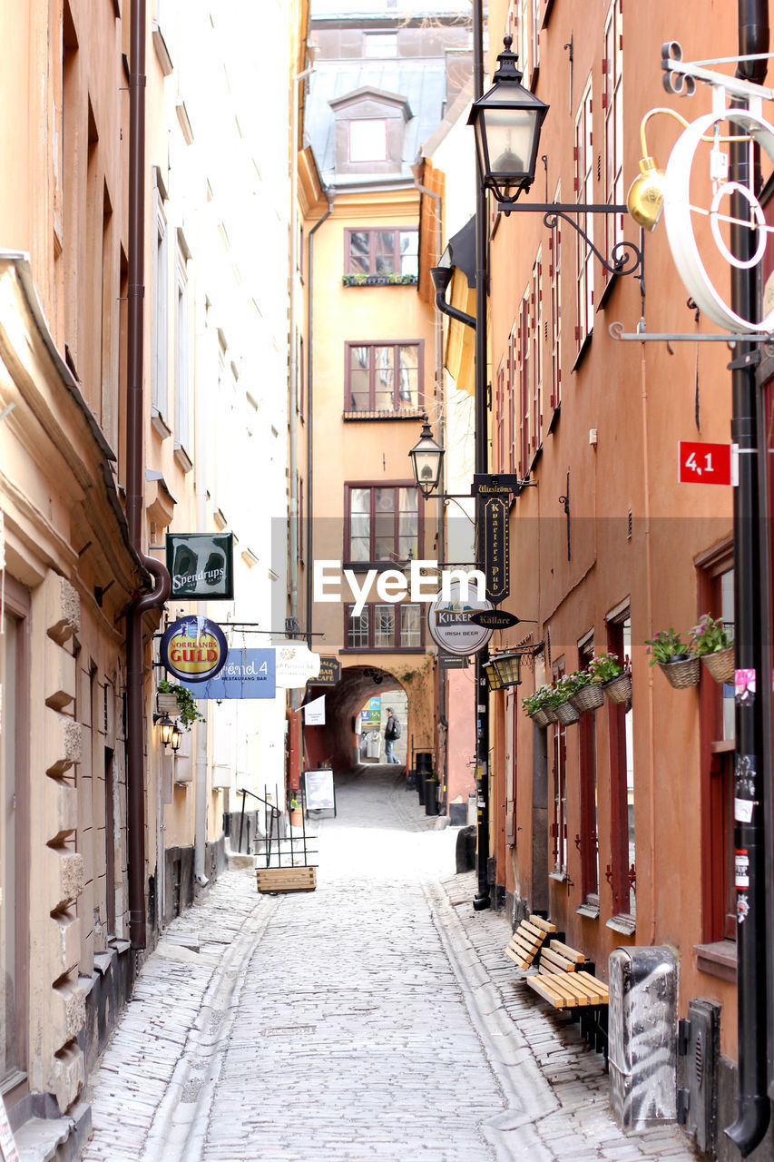 NARROW STREET AMIDST BUILDINGS