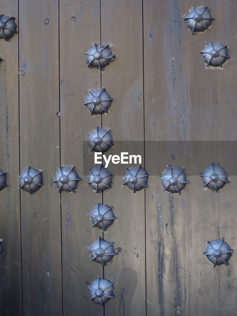 FULL FRAME SHOT OF DECORATION HANGING AGAINST DOOR