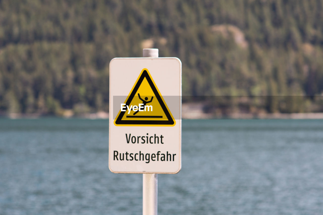 Close-up of danger sign in german 