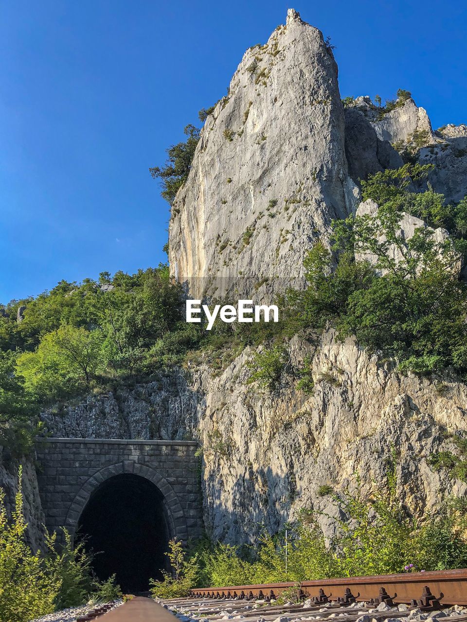 Low angle view of stone bridge against sky