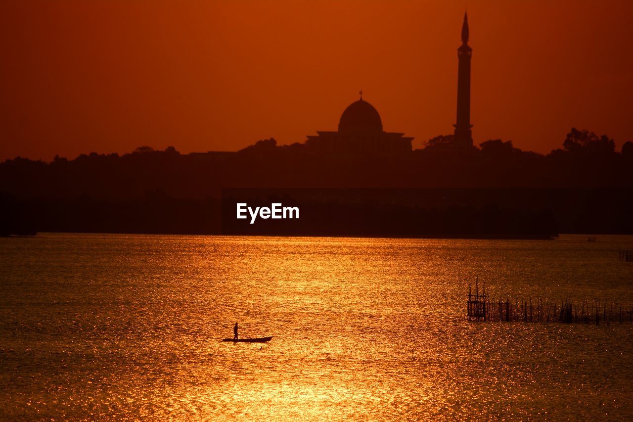 SILHOUETTE OF A TEMPLE AT SUNSET