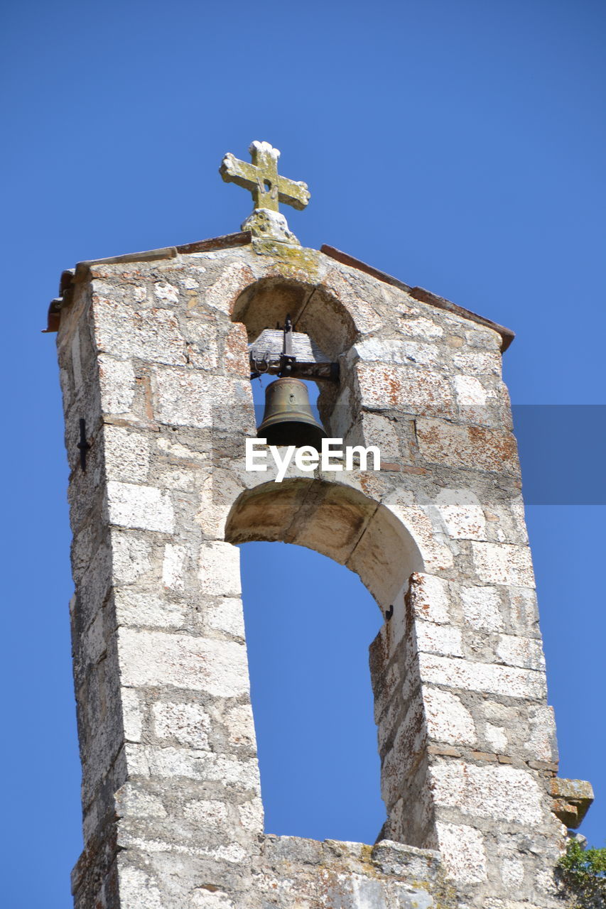 LOW ANGLE VIEW OF BELL TOWER AGAINST CLEAR SKY