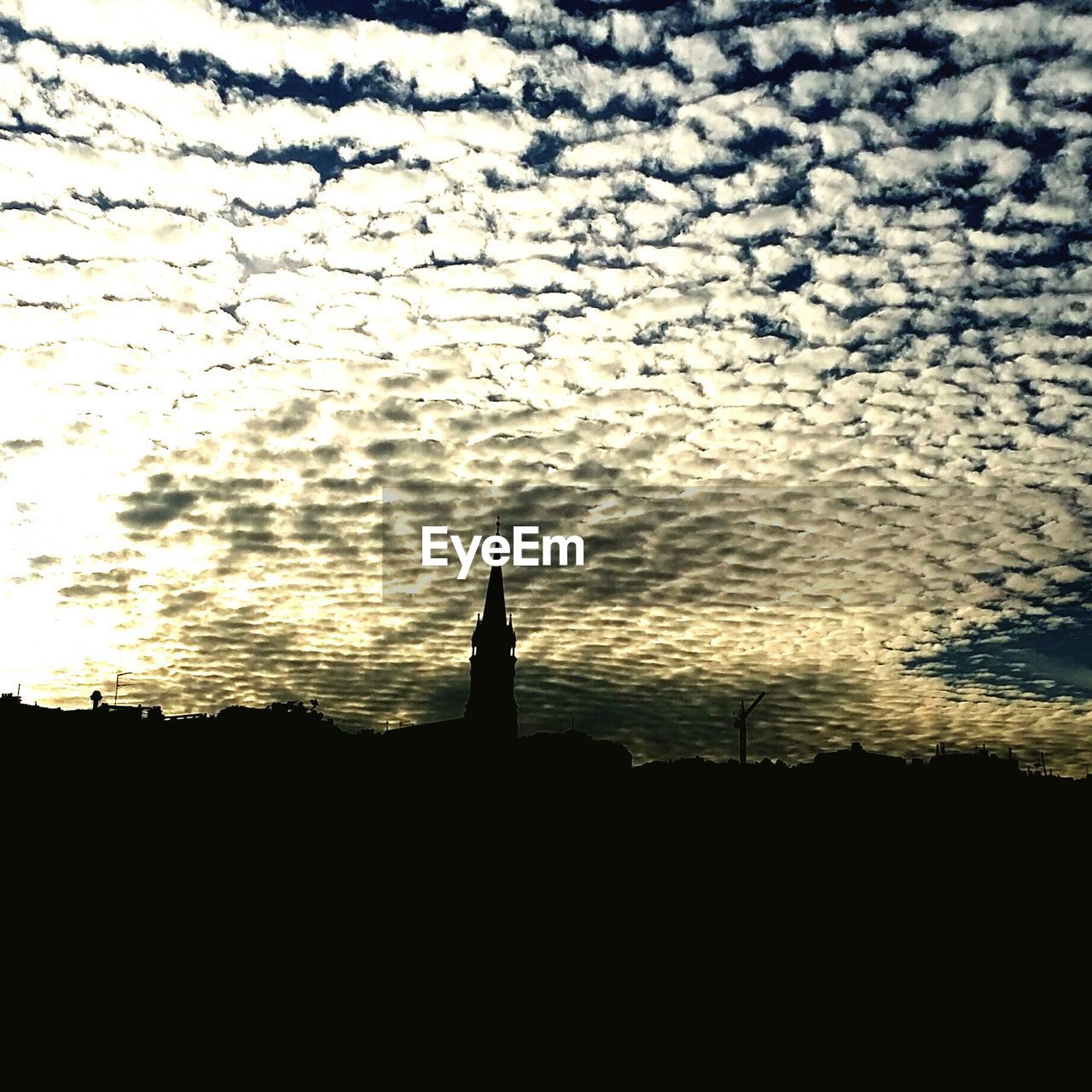 SILHOUETTE OF BUILT STRUCTURES AT SUNSET