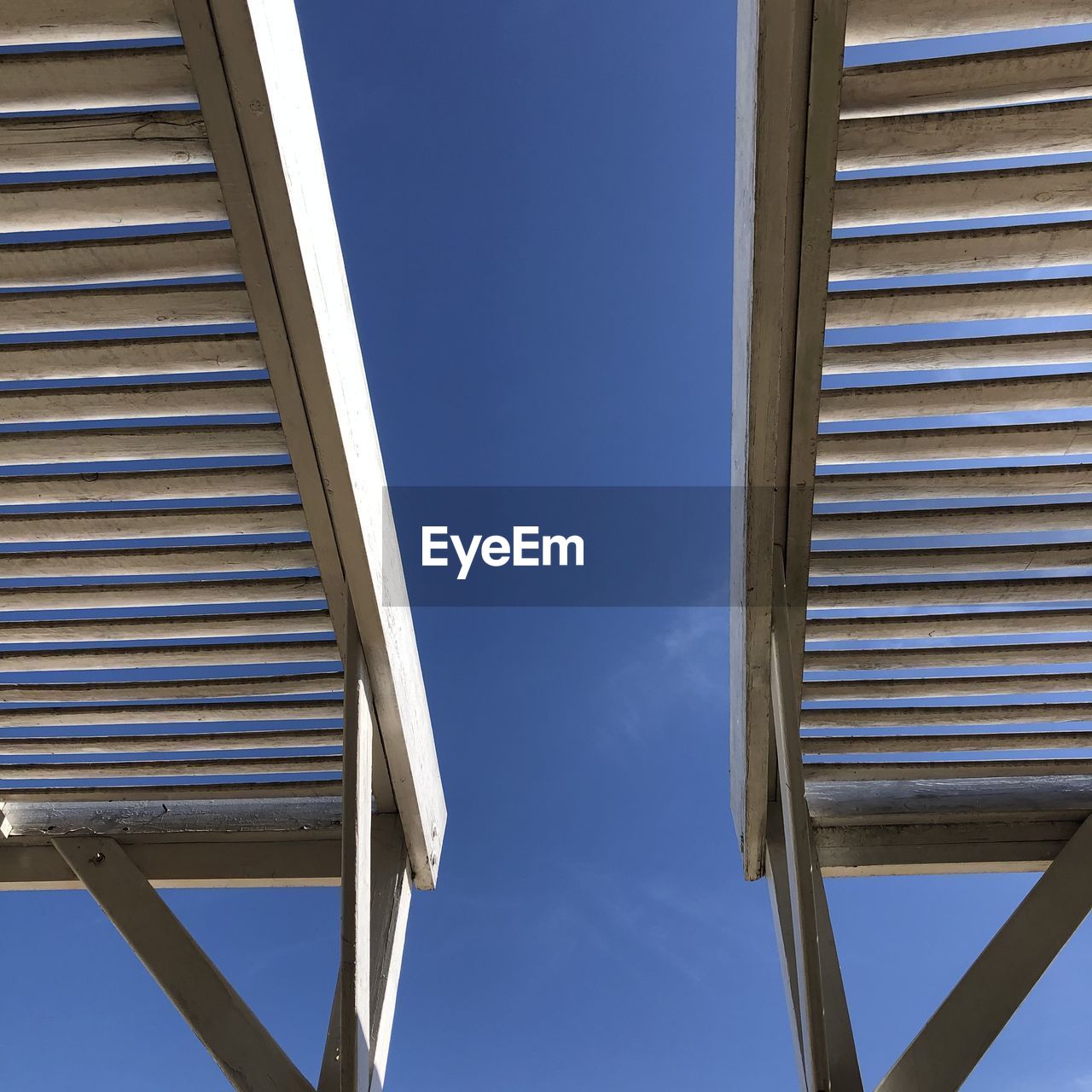 Low angle view of building against clear blue sky