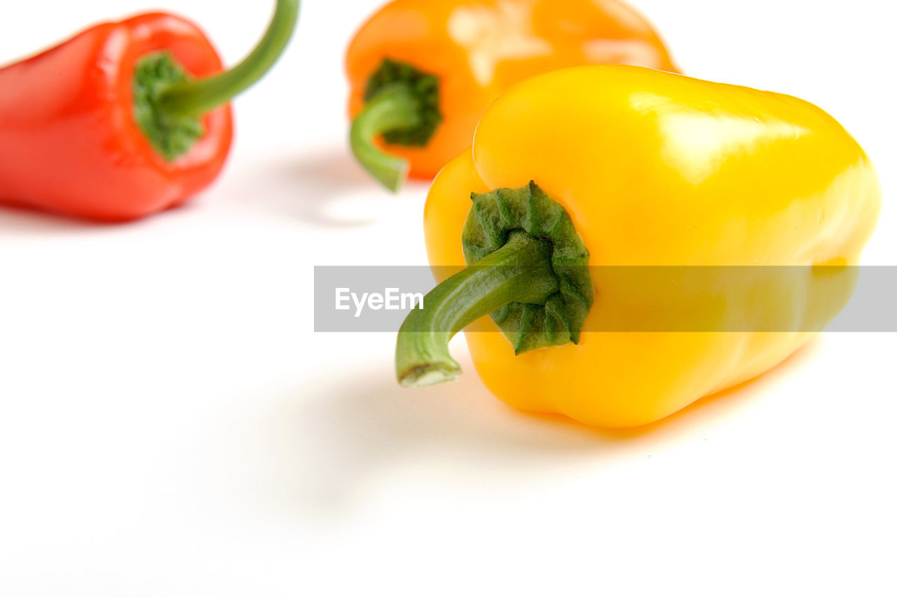 Close-up of bell peppers on white background