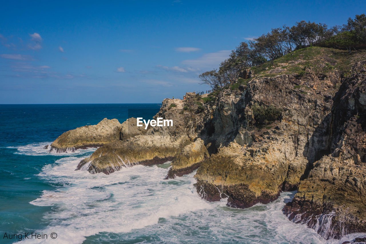 Scenic view of sea against blue sky