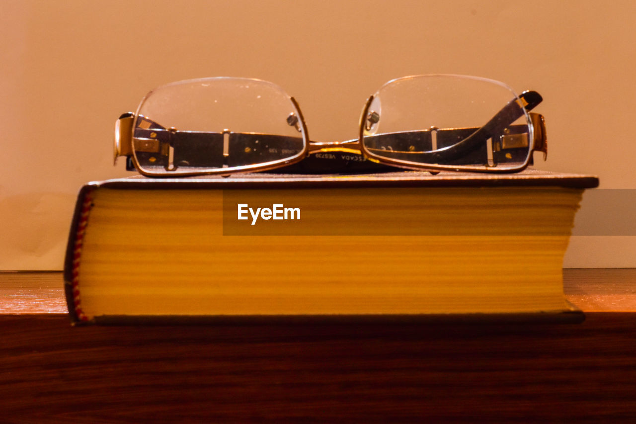 CLOSE-UP OF SUNGLASSES ON BOAT