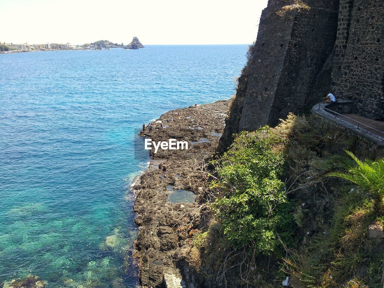 SCENIC VIEW OF SEA BY ROCKS