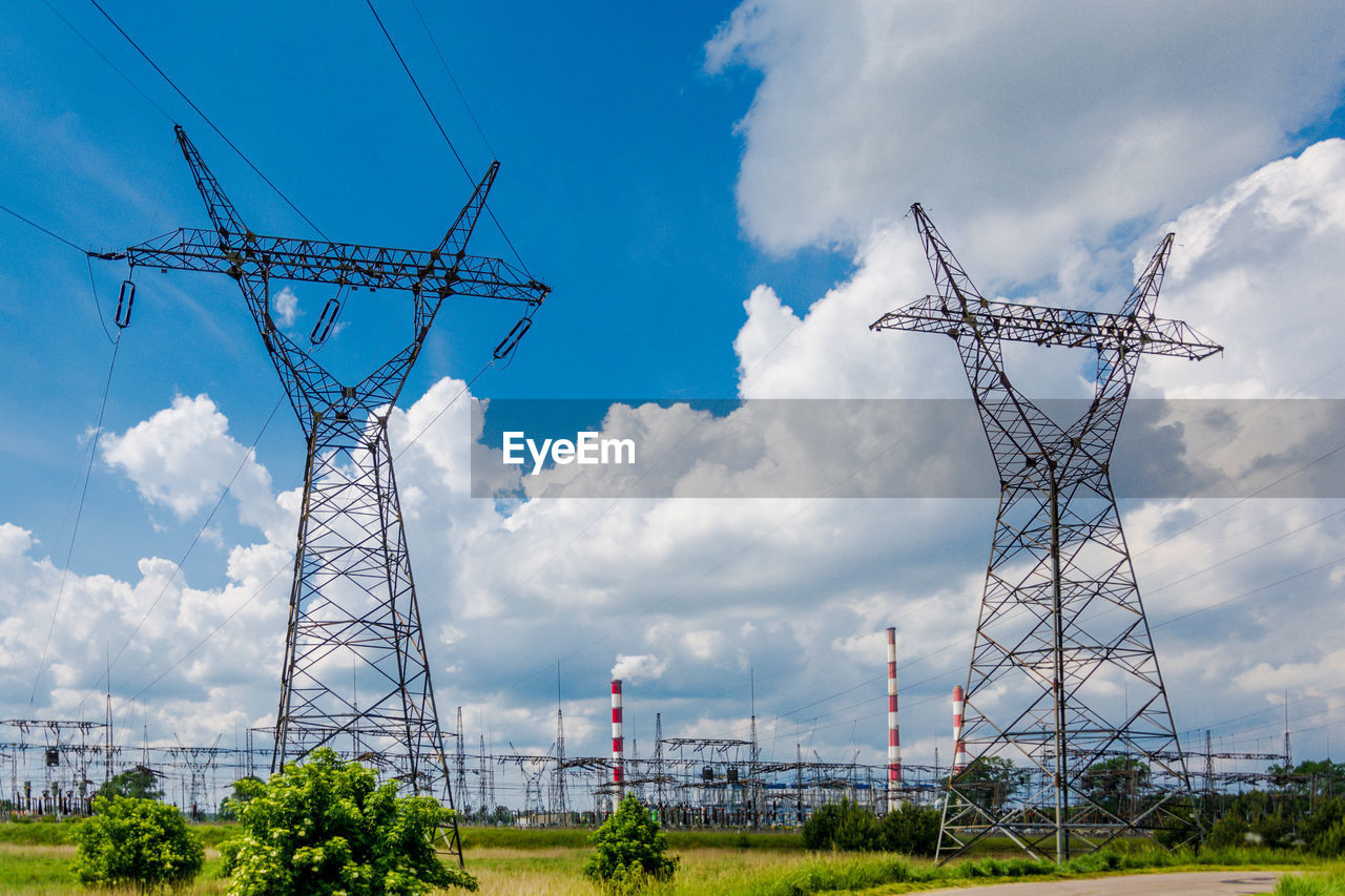 Low angle view of electricity pylon against sky