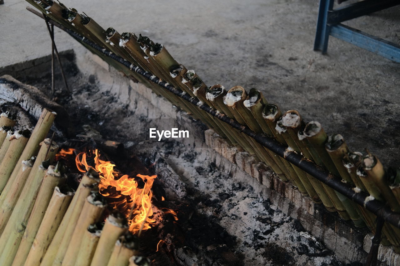 burning, firearm, fire, iron, flame, heat, high angle view, nature, no people, metal, weapon, wood, track, day