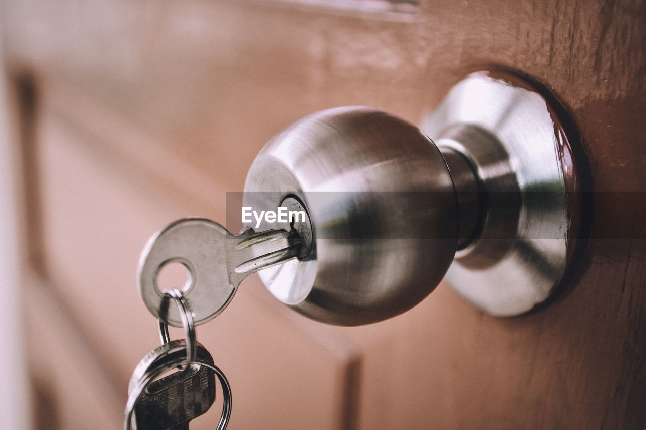 Close-up of key on doorknob