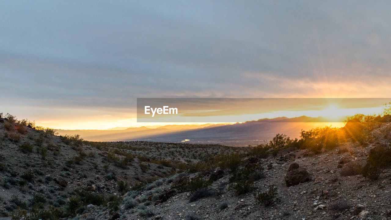 SUNSET OVER LANDSCAPE