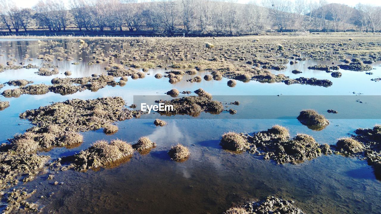 Reflection of rocks in lake water