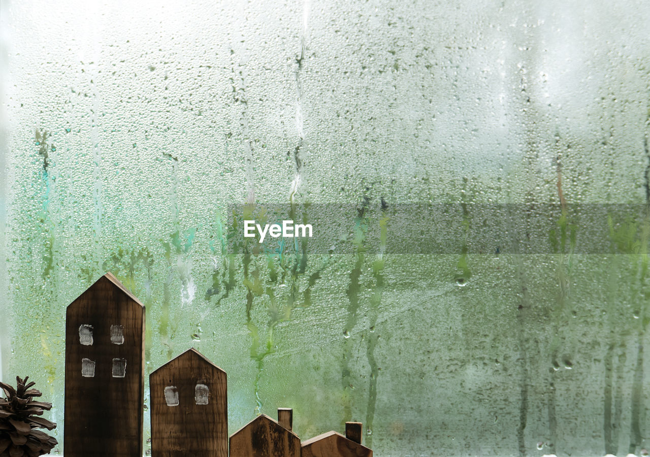 Wet glass window of building