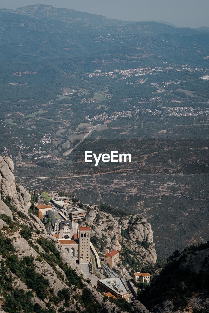 HIGH ANGLE VIEW OF TOWNSCAPE AND MOUNTAIN