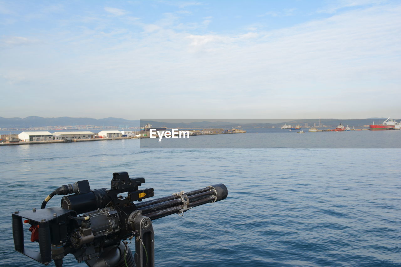 View of city by sea against sky