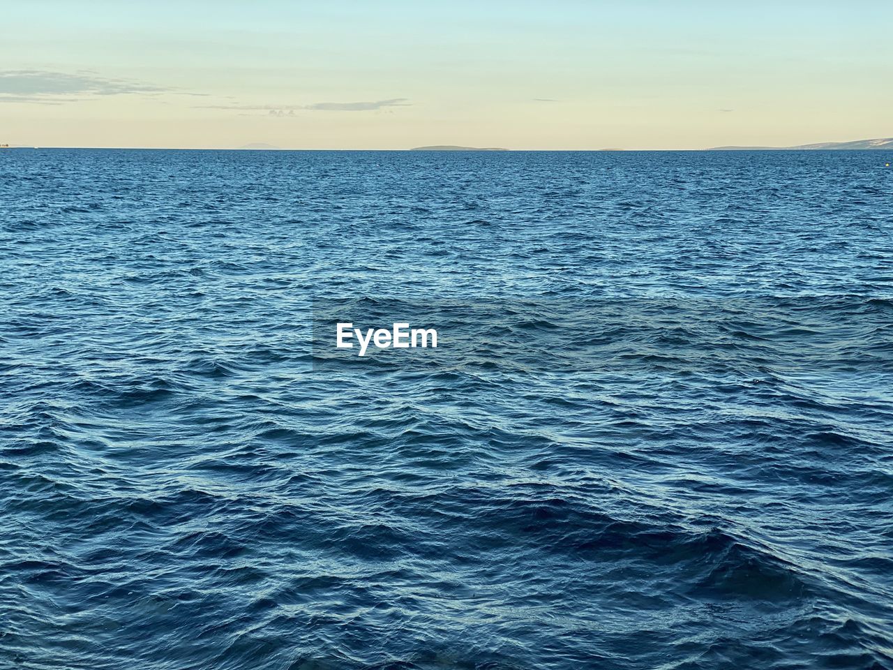 SCENIC VIEW OF SEA AGAINST BLUE SKY