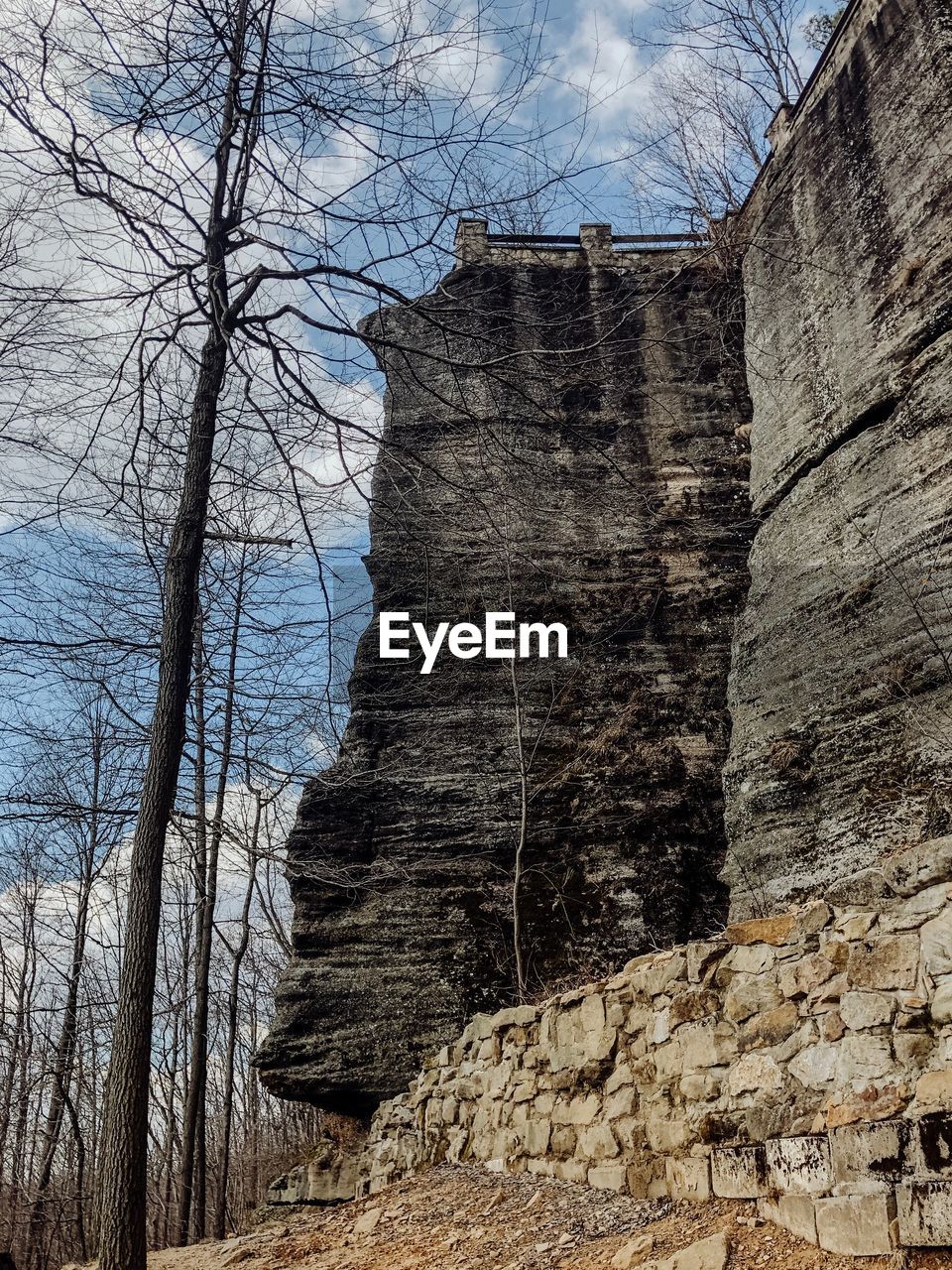 LOW ANGLE VIEW OF ROCK FORMATION ON LAND AGAINST SKY