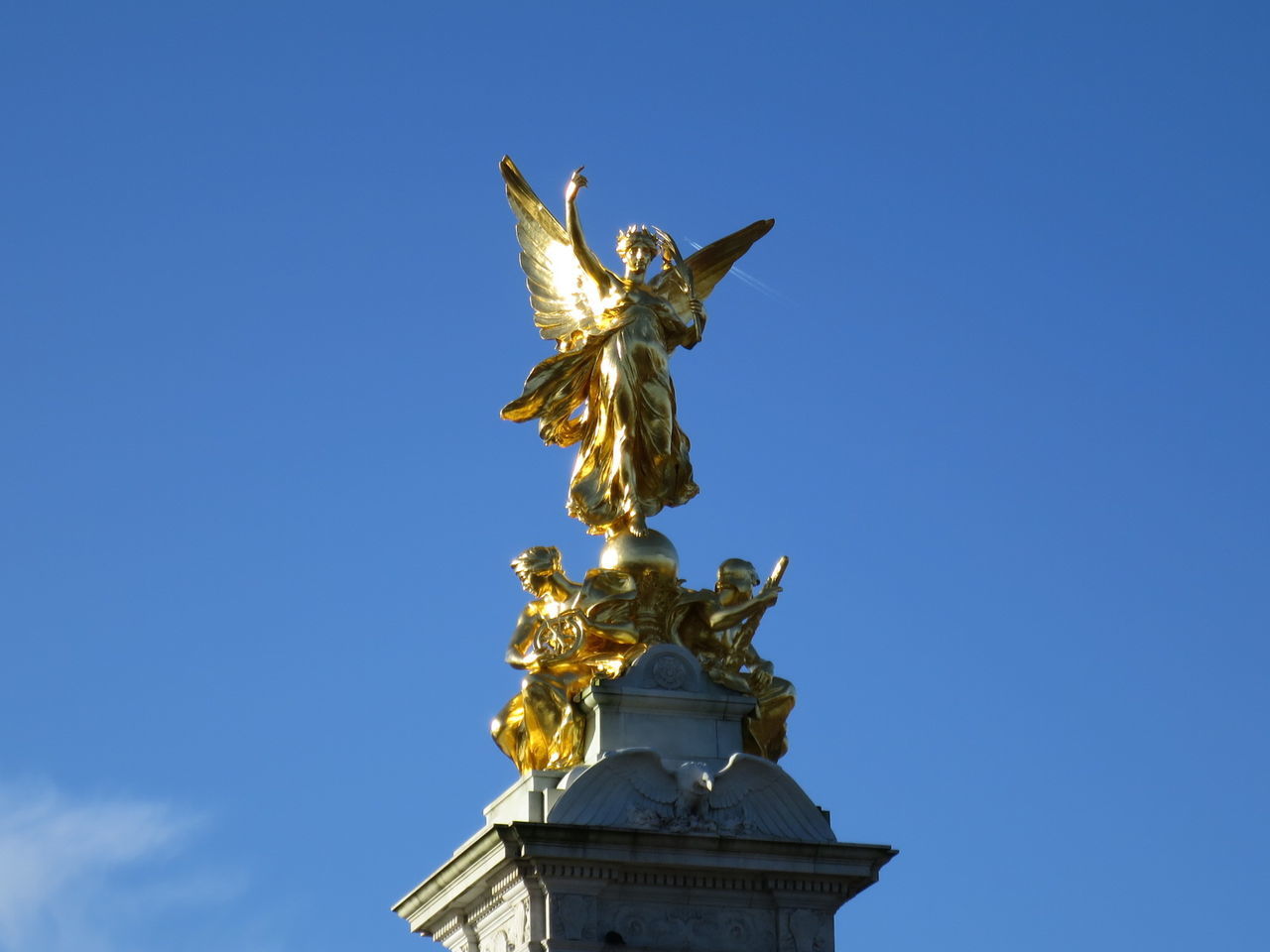 Low angle view of statue against clear blue sky