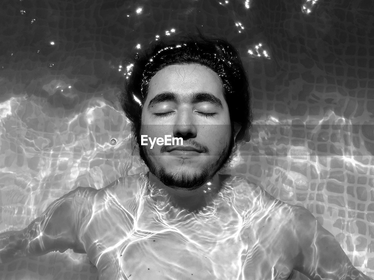 Young man in swimming pool