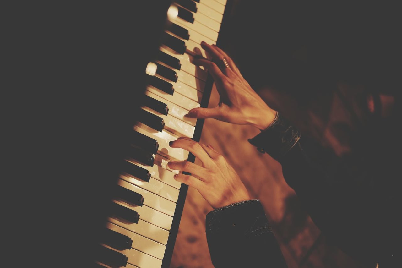 High angle view of woman playing piano