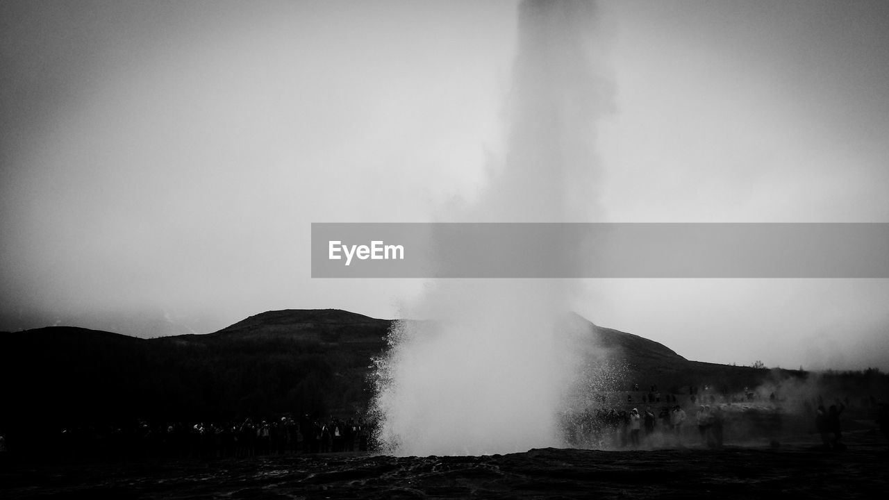 Strokkur geyser against clear sky