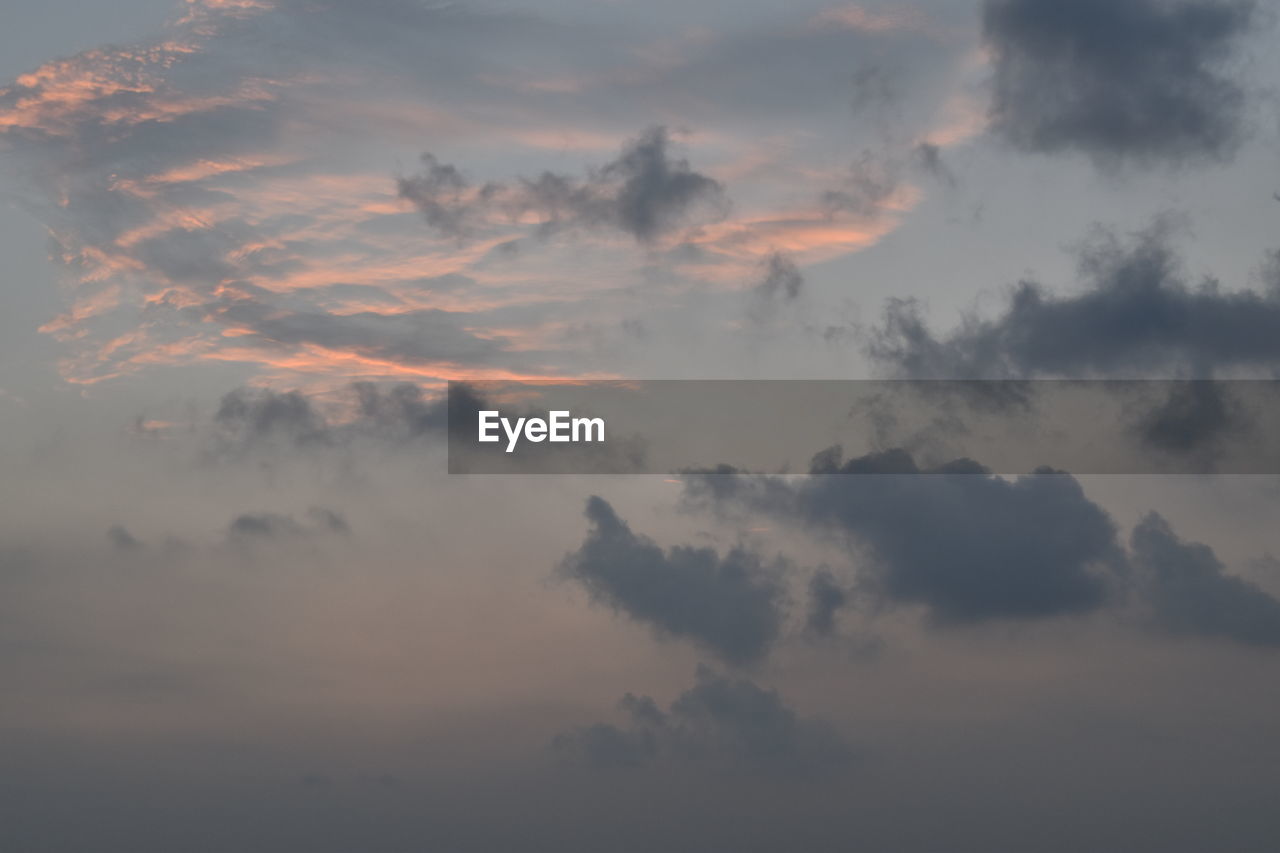 LOW ANGLE VIEW OF CLOUDY SKY AT SUNSET