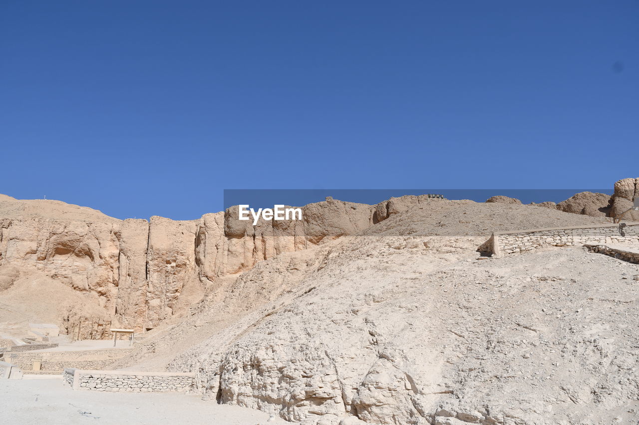 SCENIC VIEW OF ROCKY LANDSCAPE AGAINST CLEAR BLUE SKY