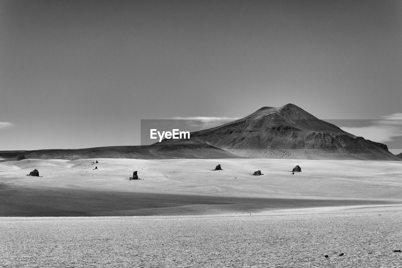 Scenic view of desert against clear sky