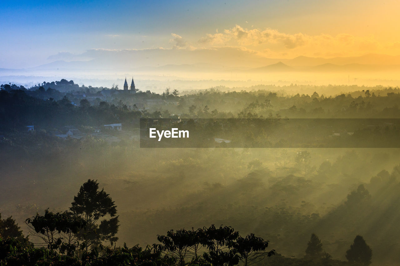 Scenic view of landscape against sky during sunset