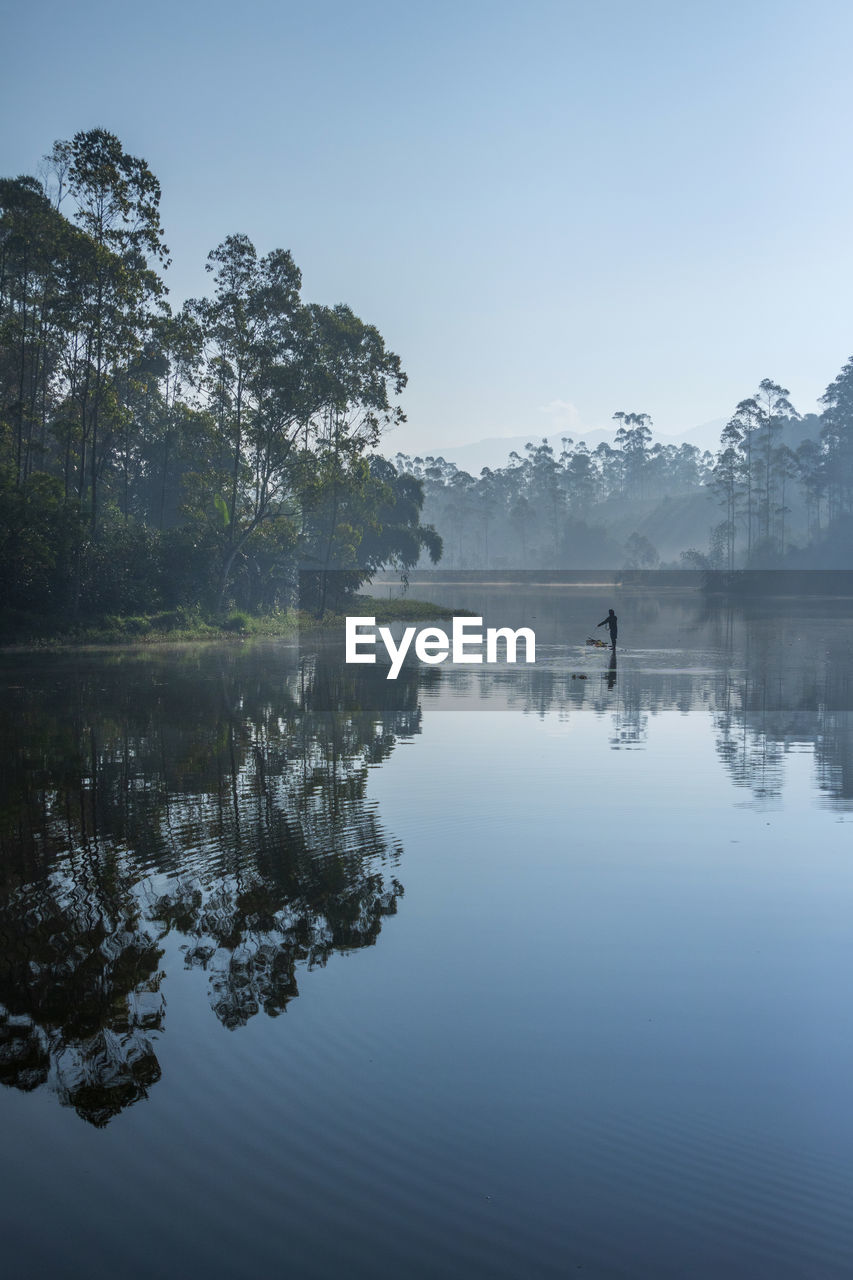 People are fishing at the morning with a beautiful scenery