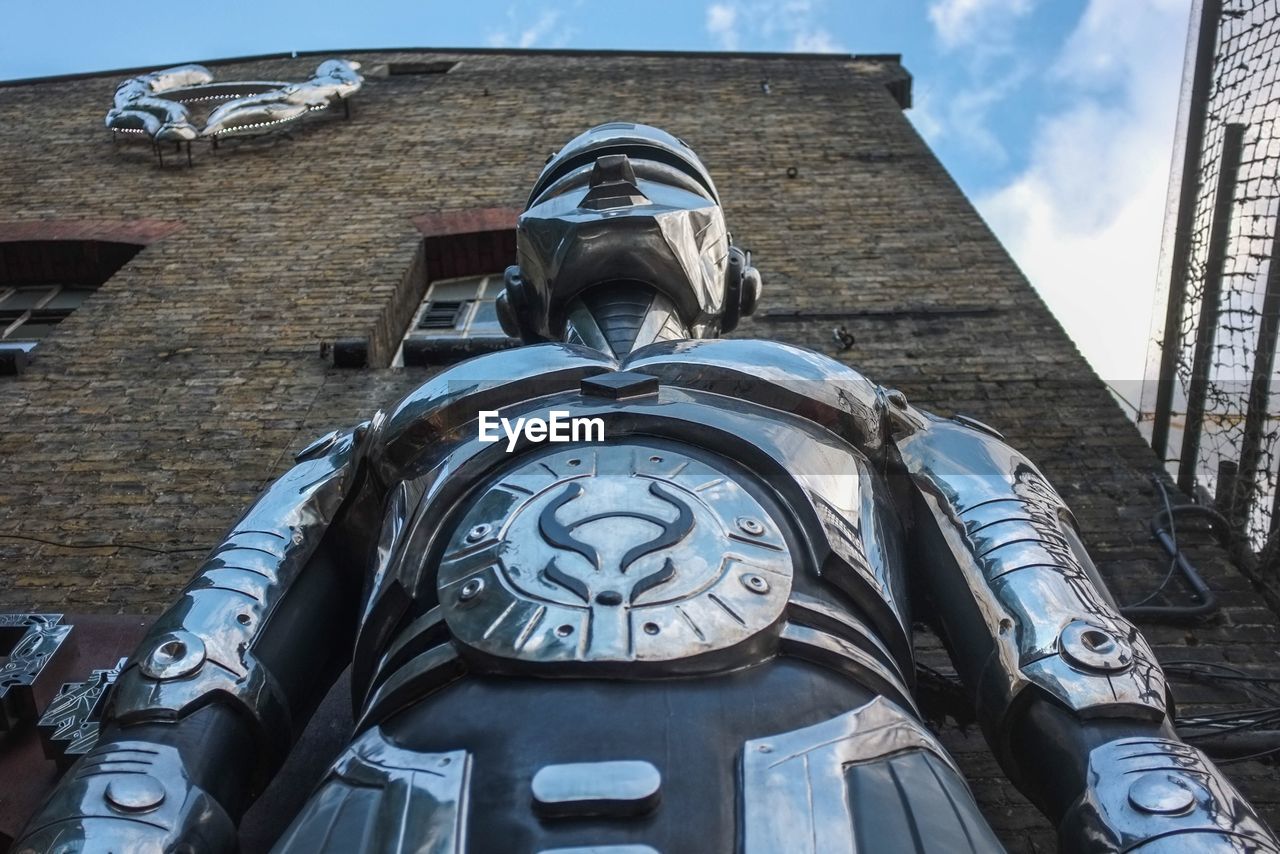 LOW ANGLE VIEW OF CLOCK AGAINST SKY