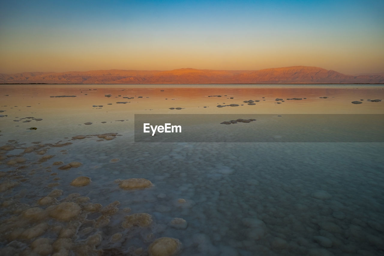 Scenic view of dead sea during sunset