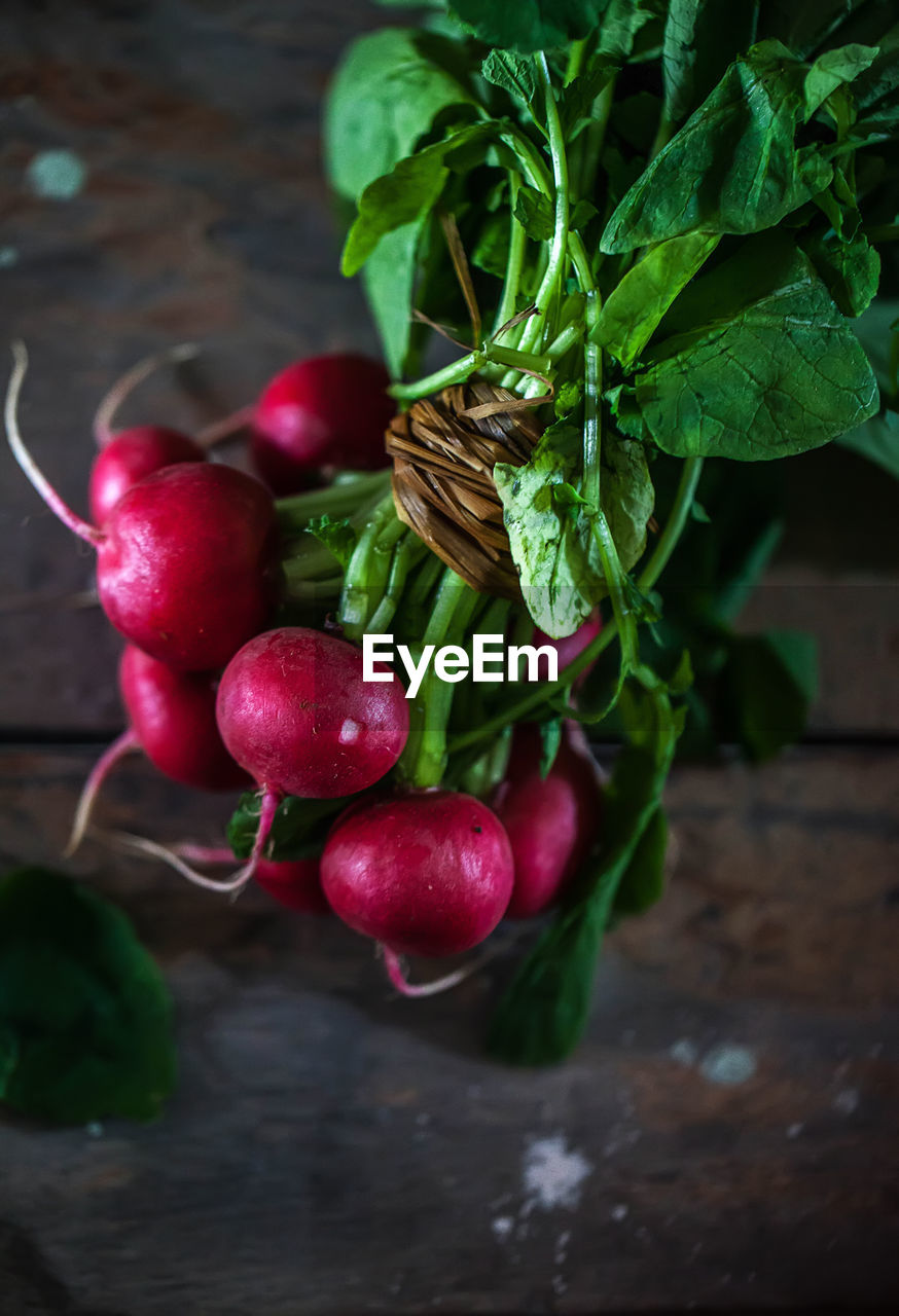 There is a bunch of delicious fresh radishes on the table